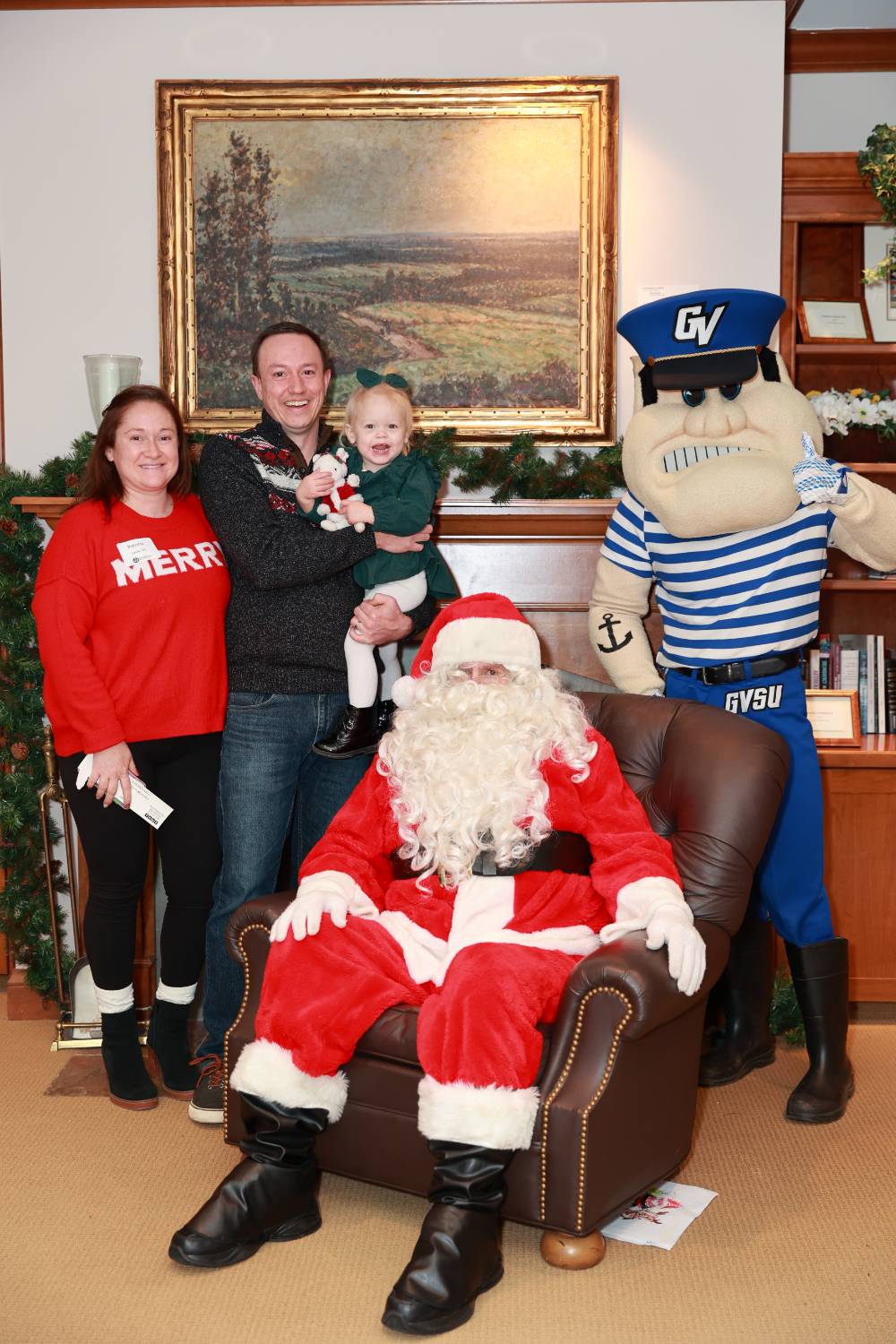 A family of three at the event with Santa & Louie.